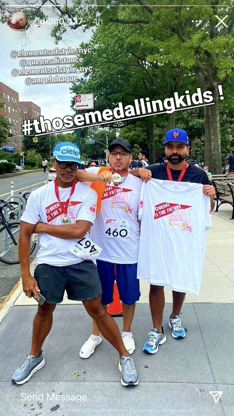 Three men wearing Queens Is The Future t-shirts at the Jackson Mile, posing for the camera with swagger