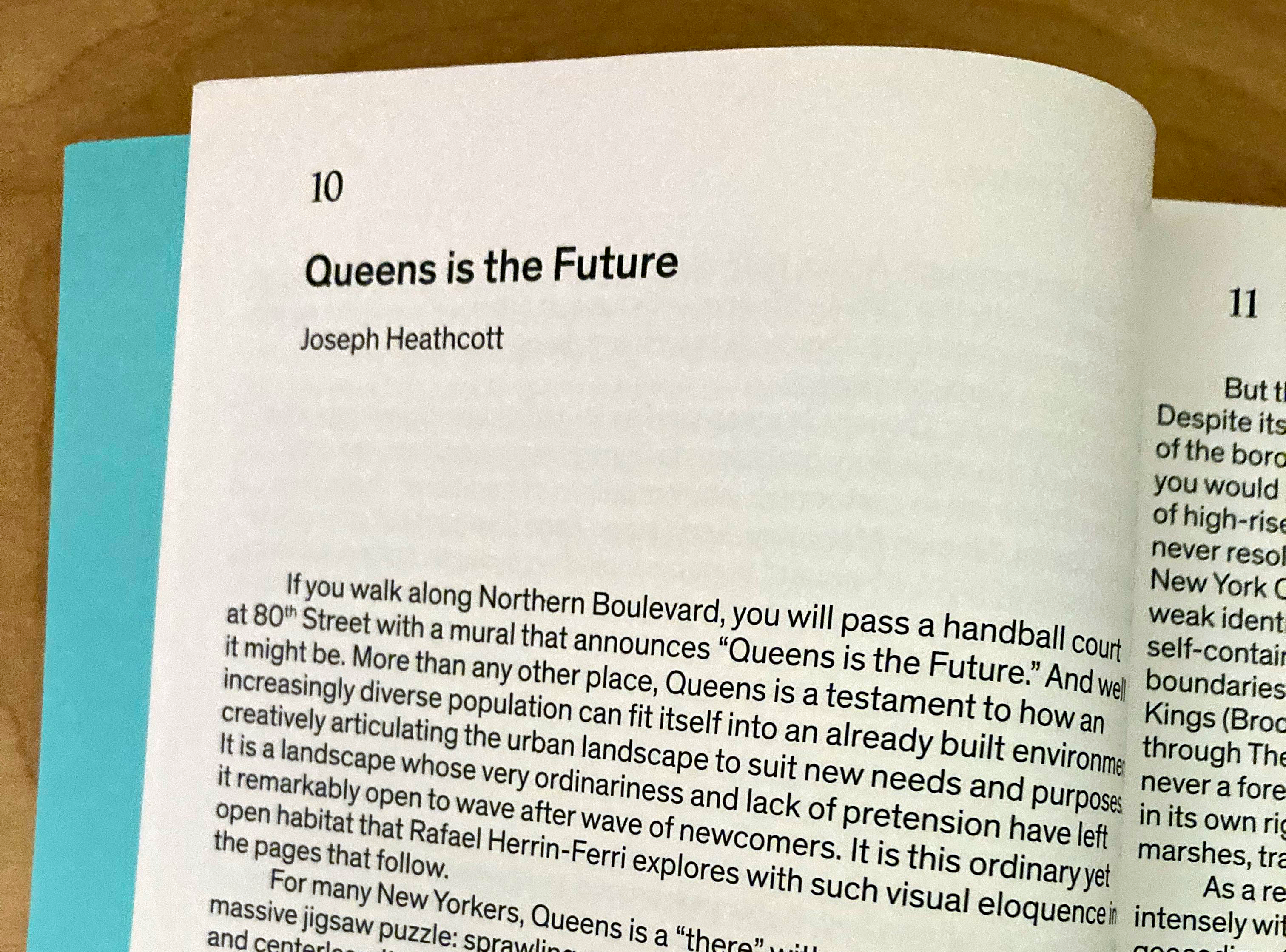 Close-up of a page in a book, the first page of its introduction, titled Queens Is The Future